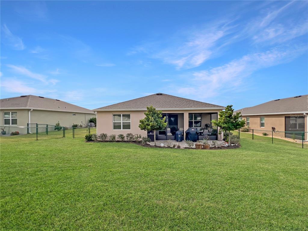 6265 Southwest 88th Loop Ocala, FL 34476 - Photo 41 of 42 a view of a house with garden and sitting area