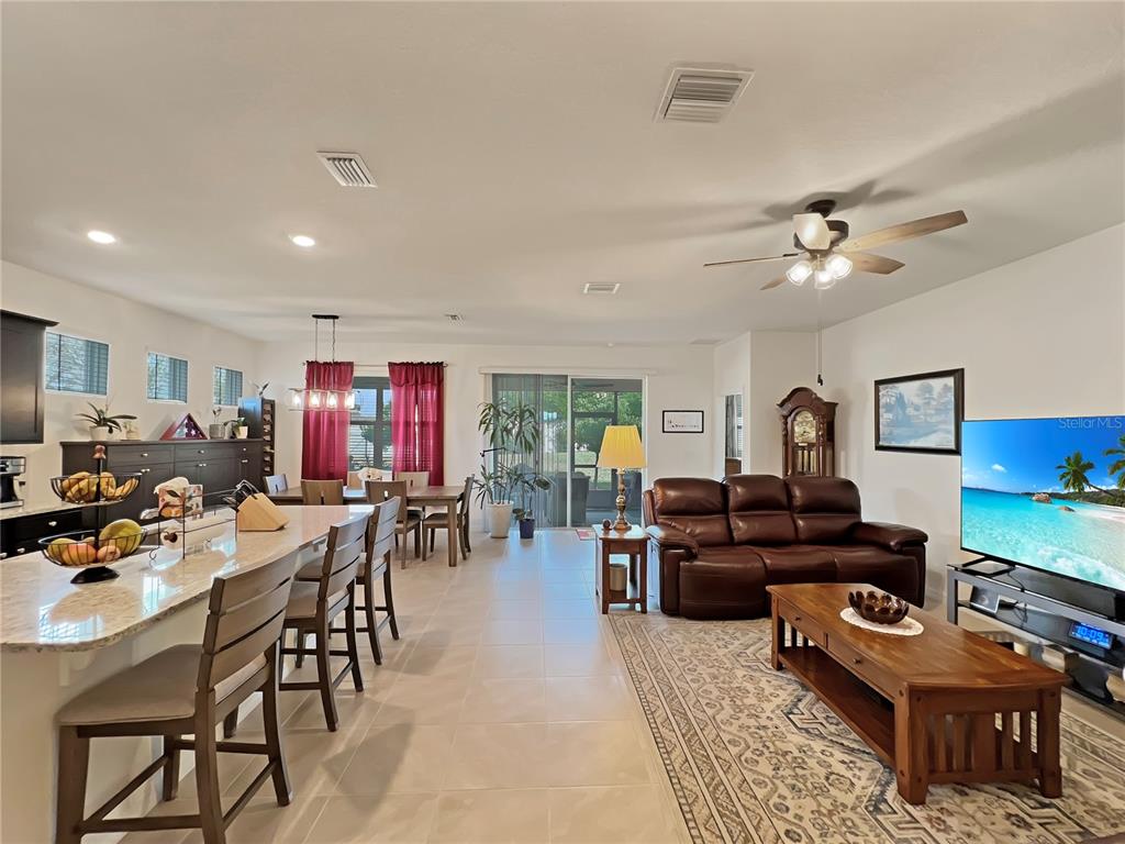 6265 Southwest 88th Loop Ocala, FL 34476 - Photo 5 of 42 a living room with furniture kitchen view and a window