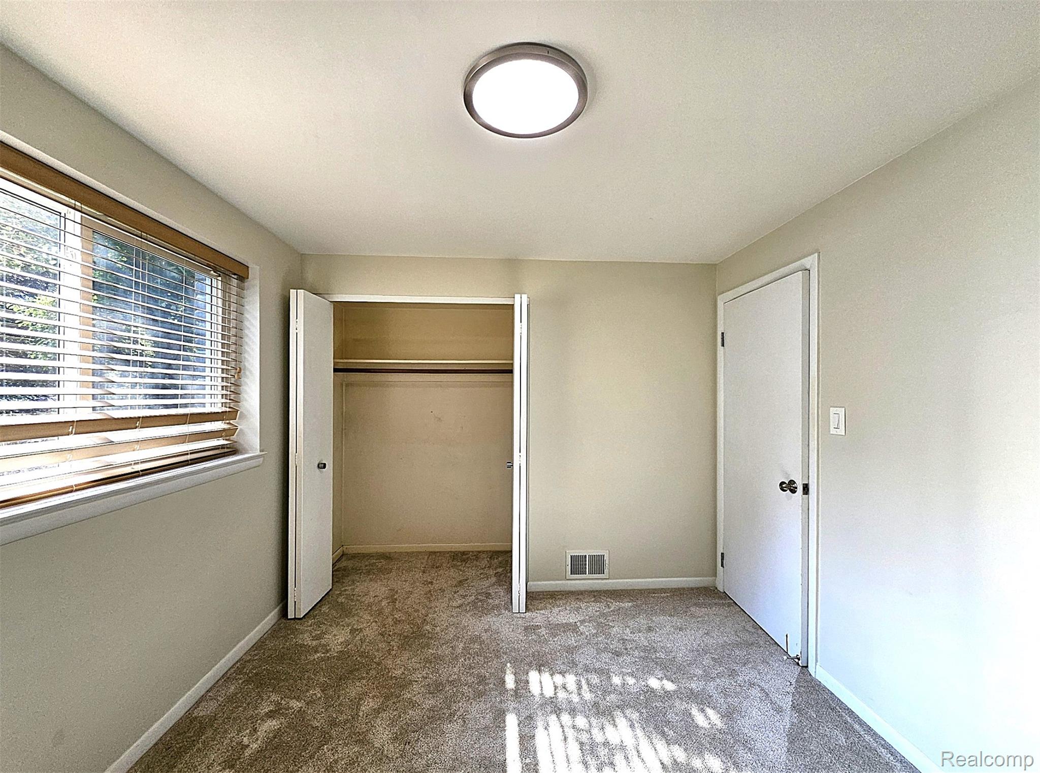 7120 Pebblecreek Road West Bloomfield, MI 48322 - Photo 24 of 31 Neutral tone wall paint with a window featuring horizontal blinds