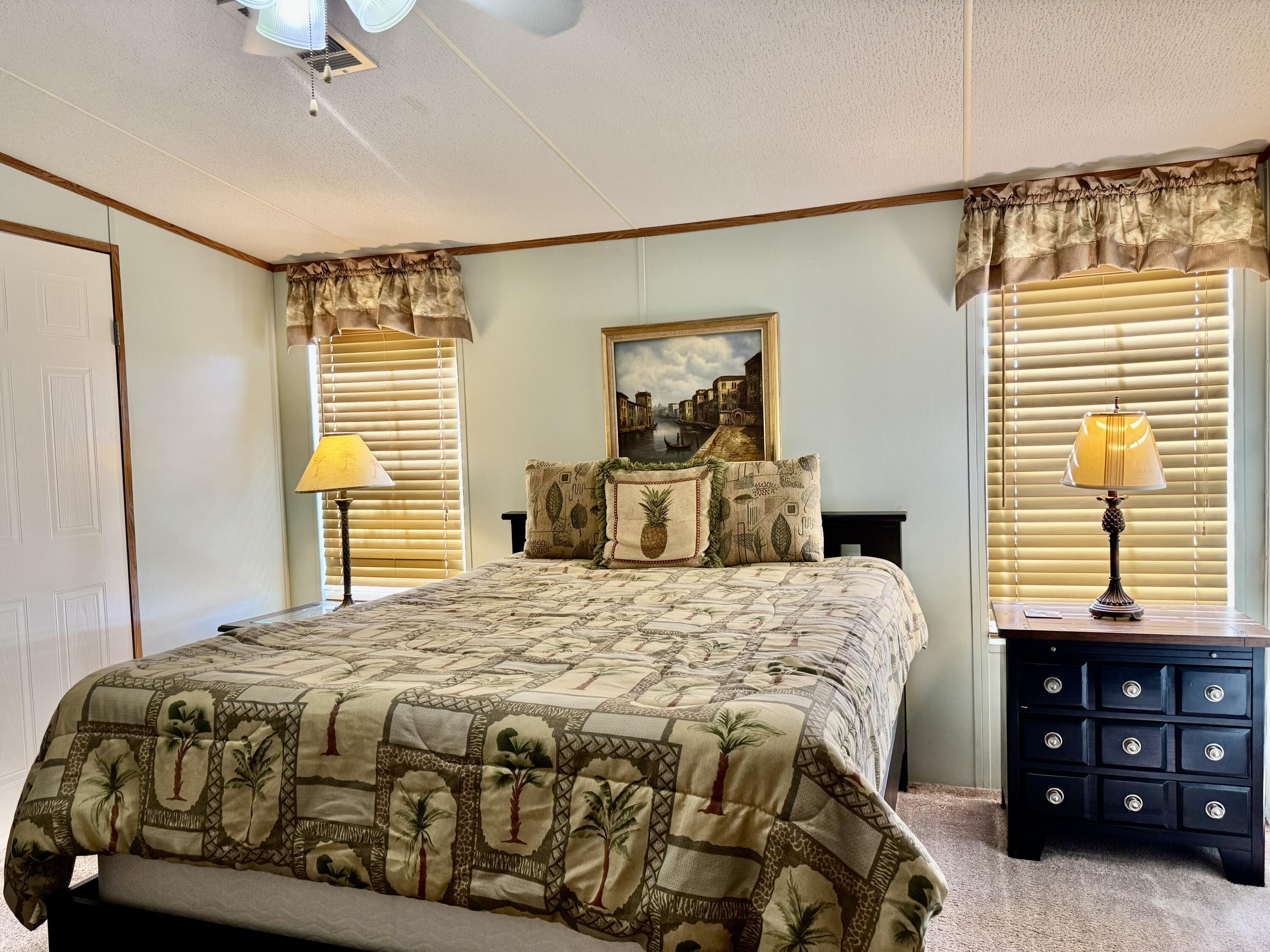 2305 Southeast 31st Street Okeechobee, FL 34974 - Photo 11 of 30 a bedroom with a bed and a window