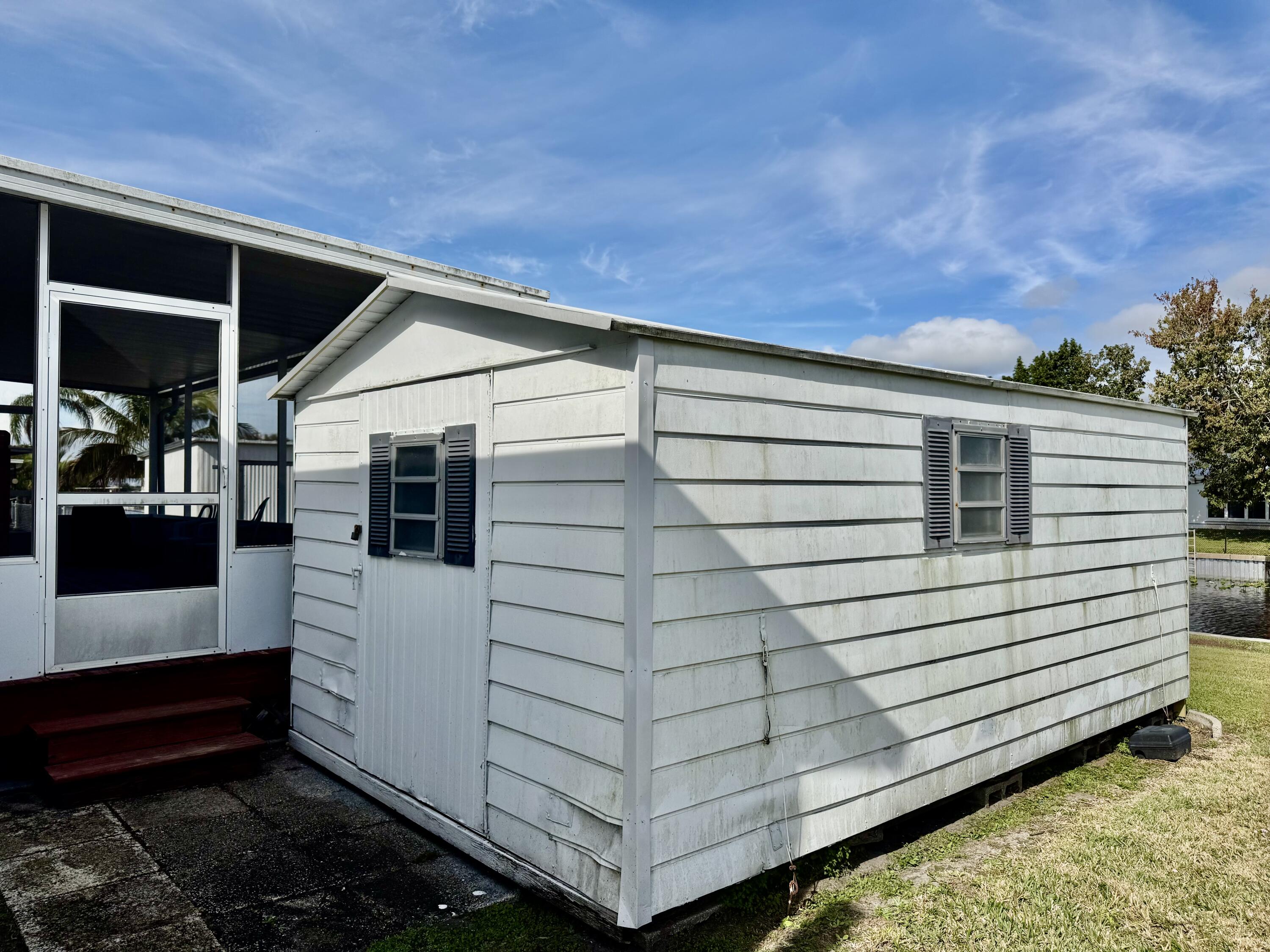 2305 Southeast 31st Street Okeechobee, FL 34974 - Photo 21 of 30 a view of a house with a yard