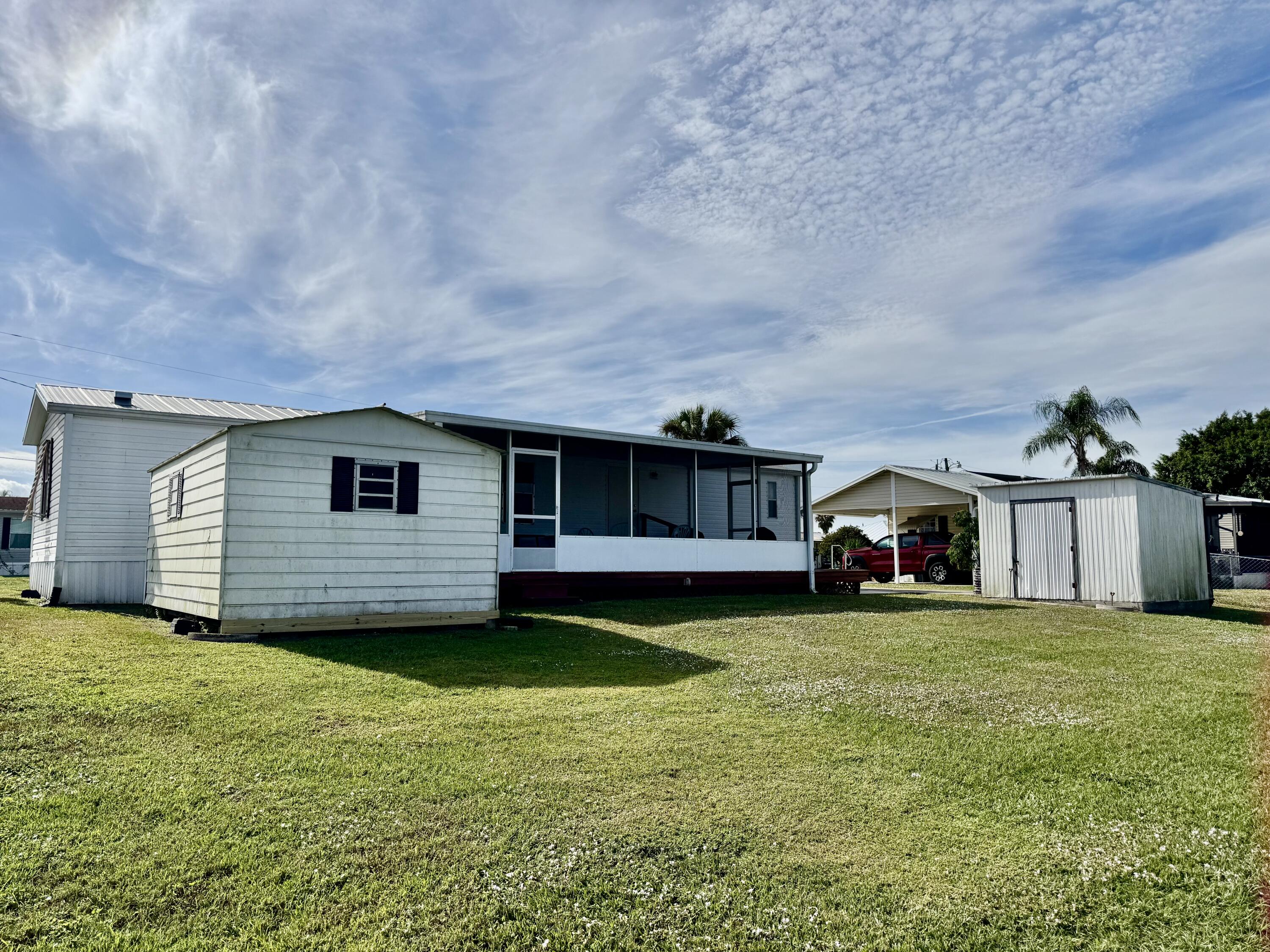 2305 Southeast 31st Street Okeechobee, FL 34974 - Photo 26 of 30 a view of a house with a yard