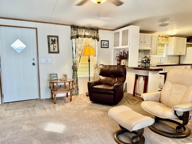 a living room with furniture and a table