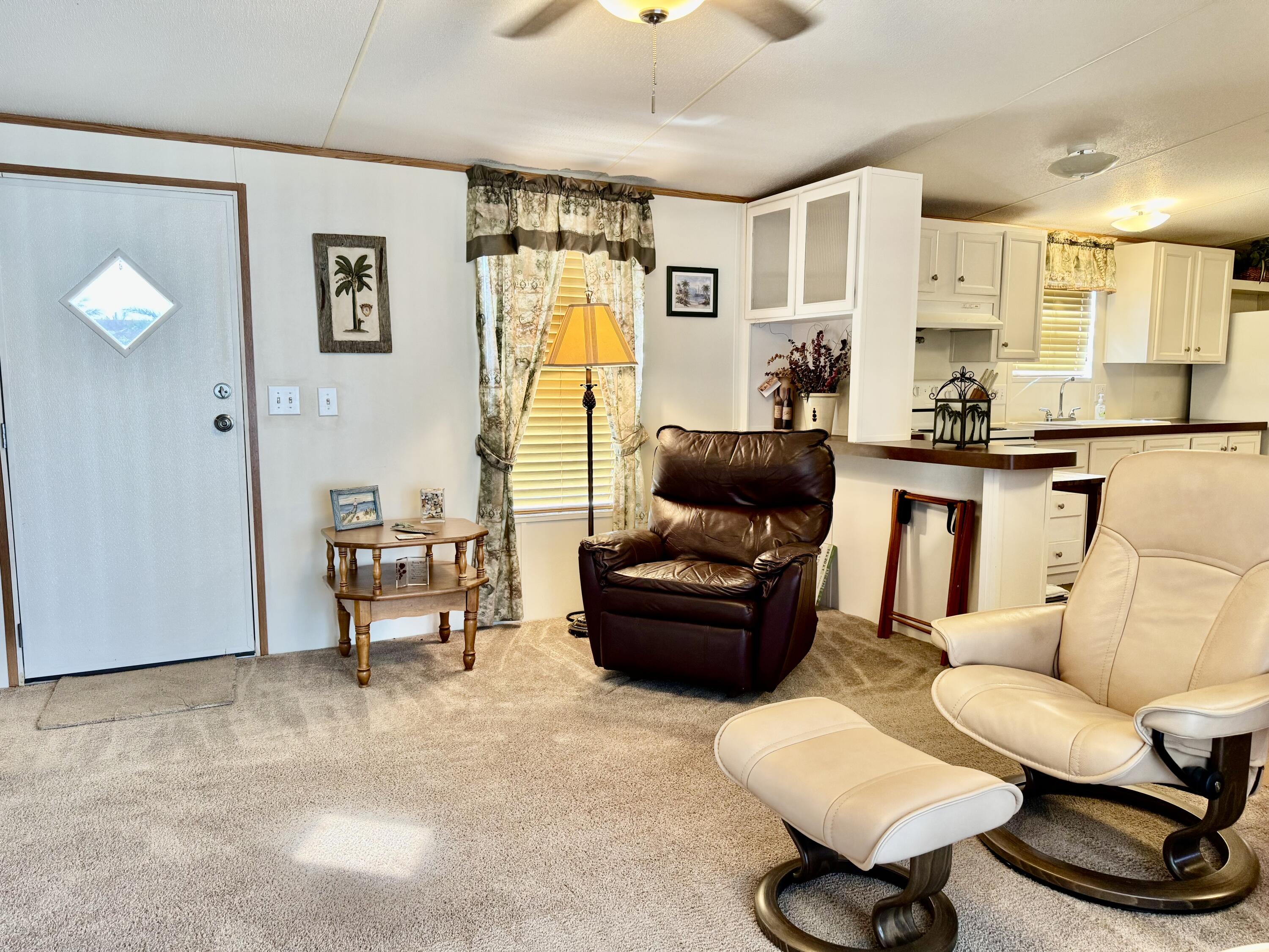 2305 Southeast 31st Street Okeechobee, FL 34974 - Photo 4 of 30 a living room with furniture and a table