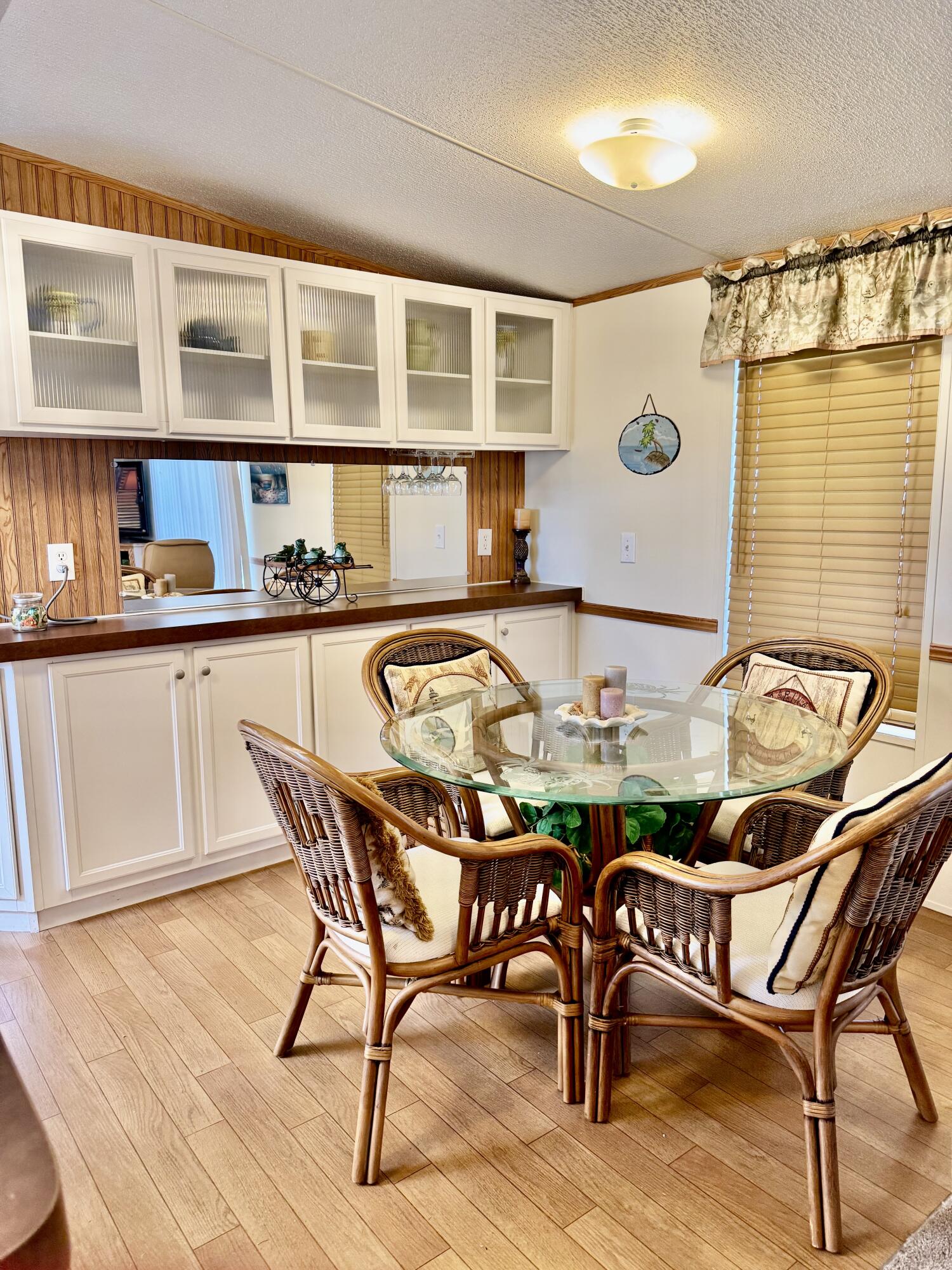 2305 Southeast 31st Street Okeechobee, FL 34974 - Photo 8 of 30 a table and chairs in a kitchen and a counter top space