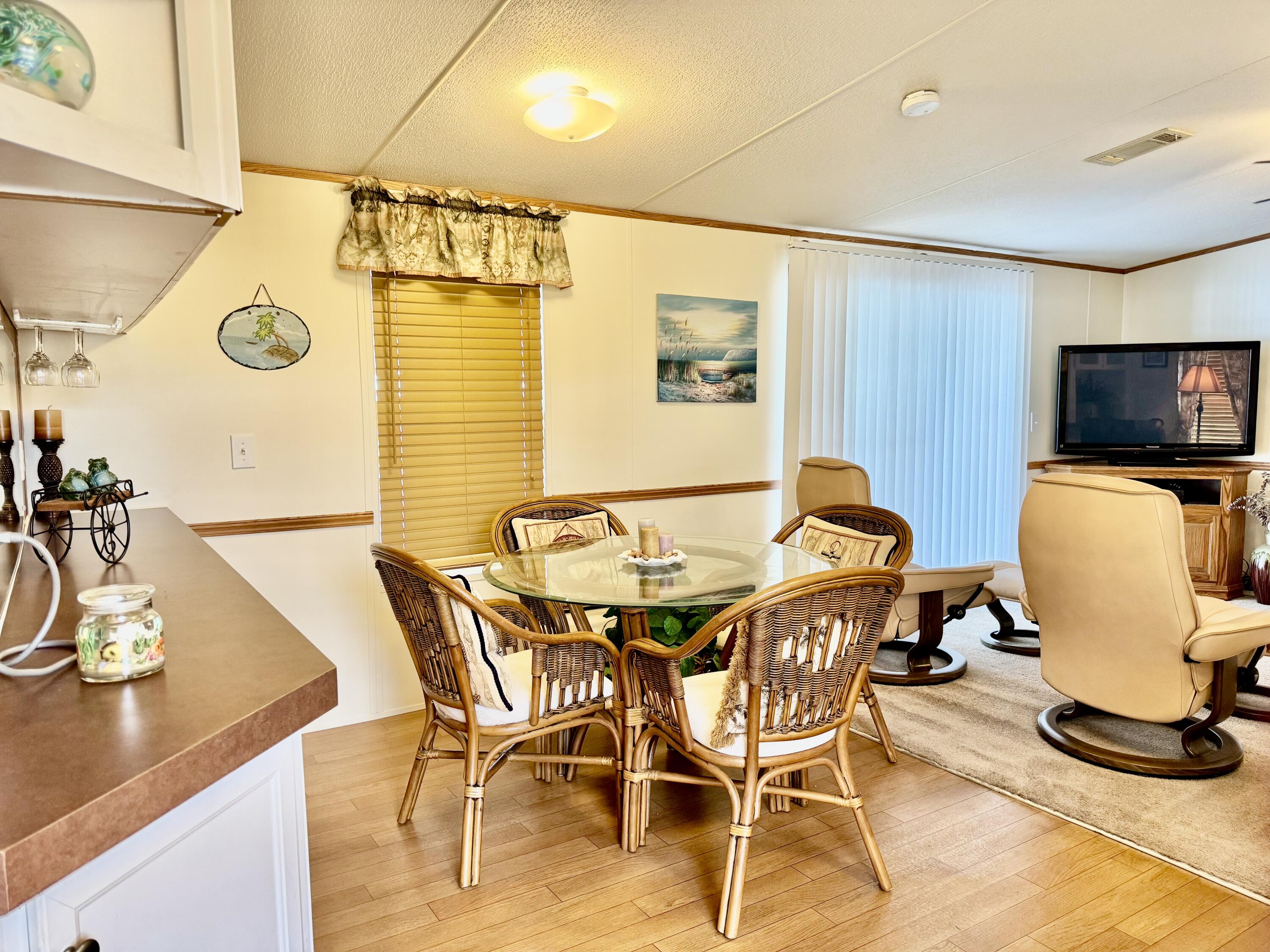 2305 Southeast 31st Street Okeechobee, FL 34974 - Photo 9 of 30 a view of a dining room with furniture