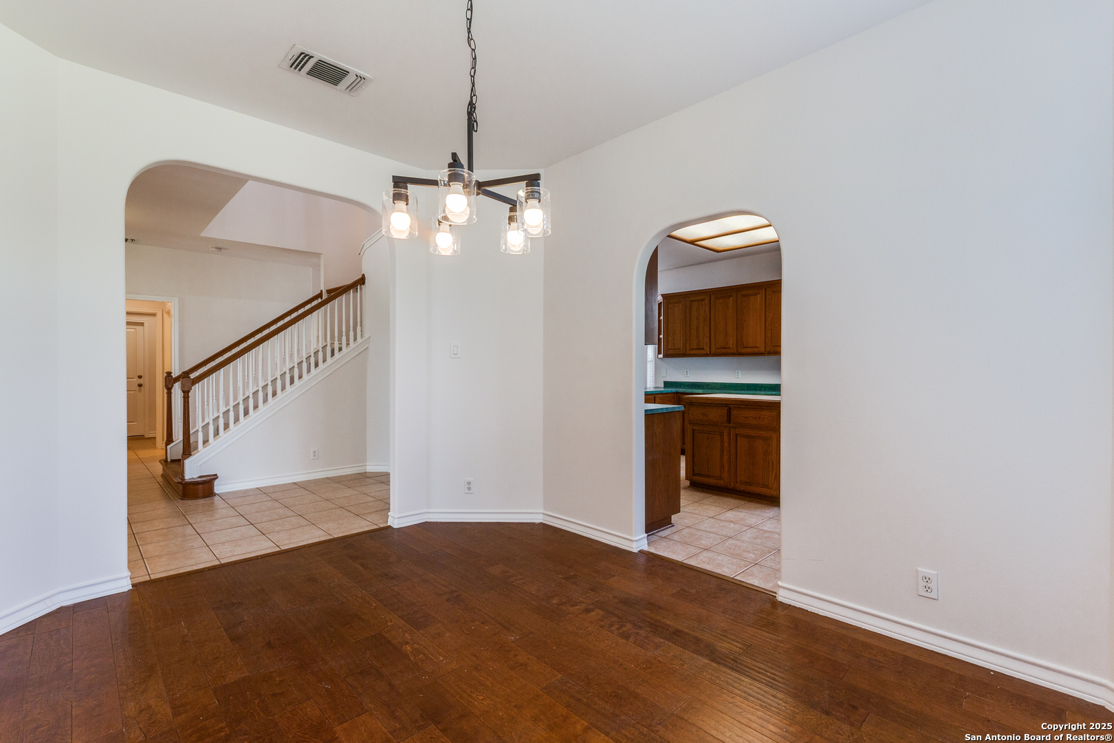 9109 Windwick Boerne, TX 78006 - Photo 11 of 35 a view of a hallway with wooden floor and entryway