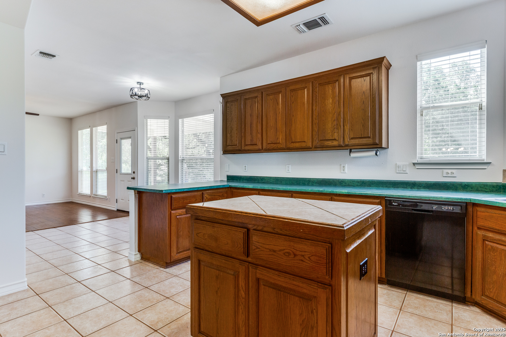 9109 Windwick Boerne, TX 78006 - Photo 16 of 35 a kitchen with granite countertop a sink and a stove