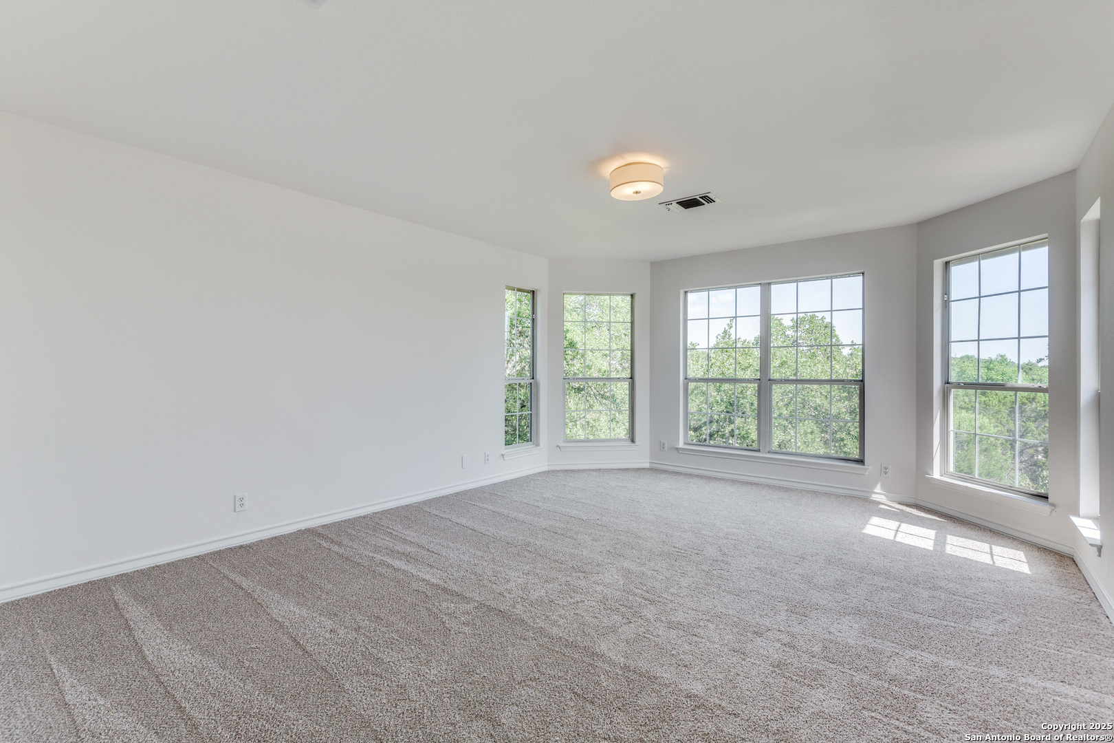 9109 Windwick Boerne, TX 78006 - Photo 18 of 35 a view of an empty room with a window