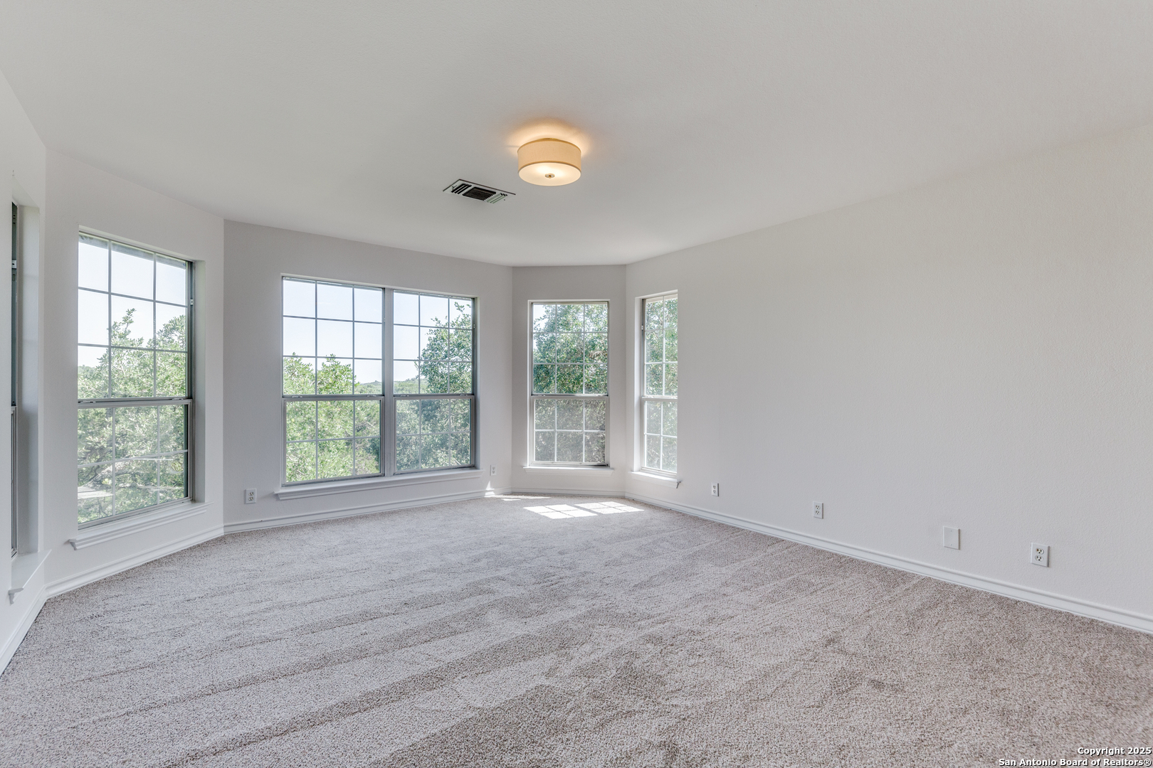 9109 Windwick Boerne, TX 78006 - Photo 19 of 35 a view of an empty room with a window