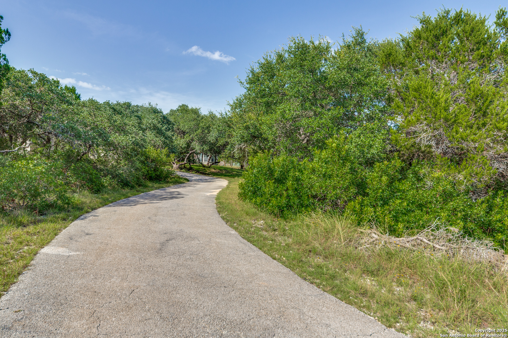 9109 Windwick Boerne, TX 78006 - Photo 2 of 35 a view of a road with a yard