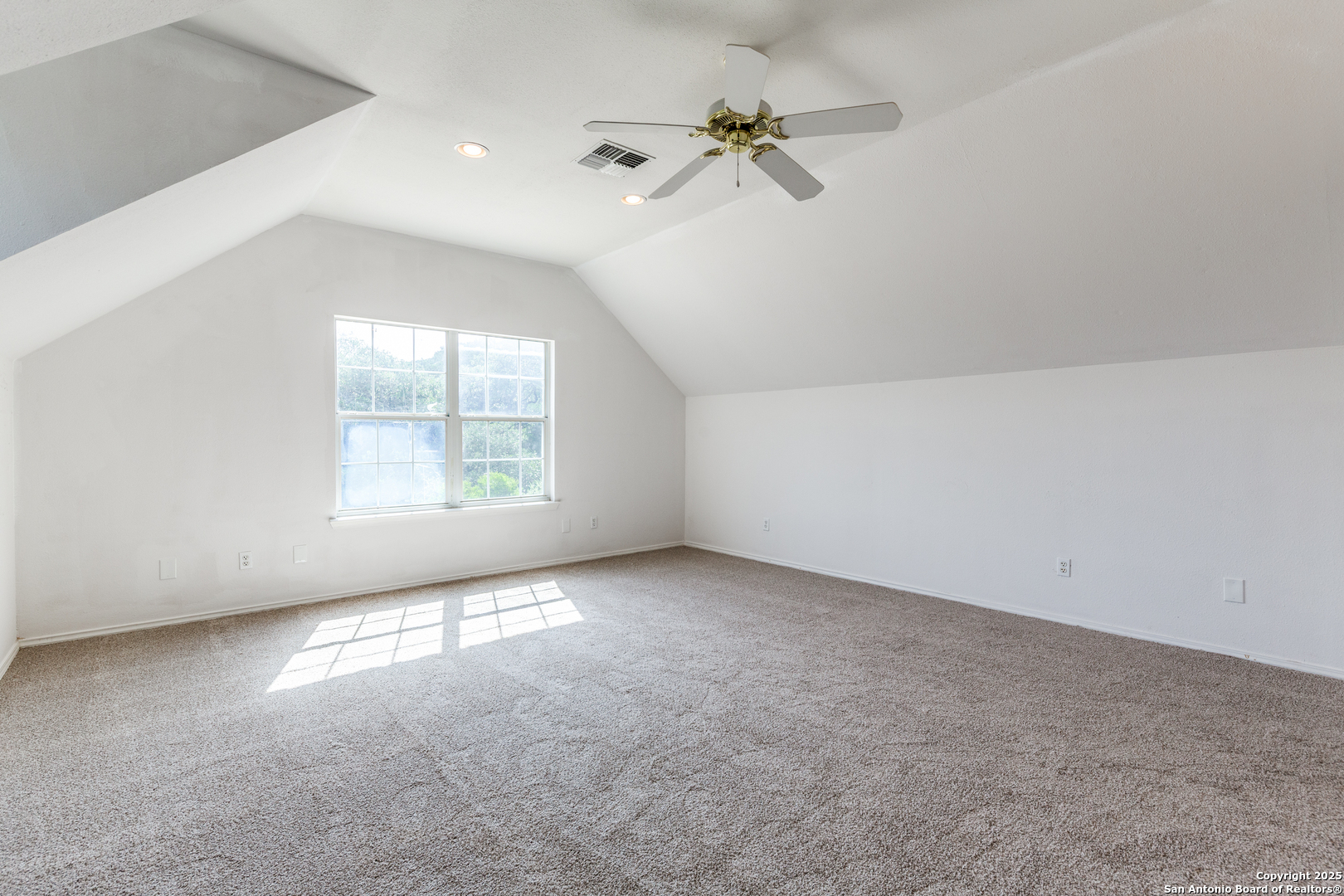 9109 Windwick Boerne, TX 78006 - Photo 25 of 35 an empty room with windows and fan