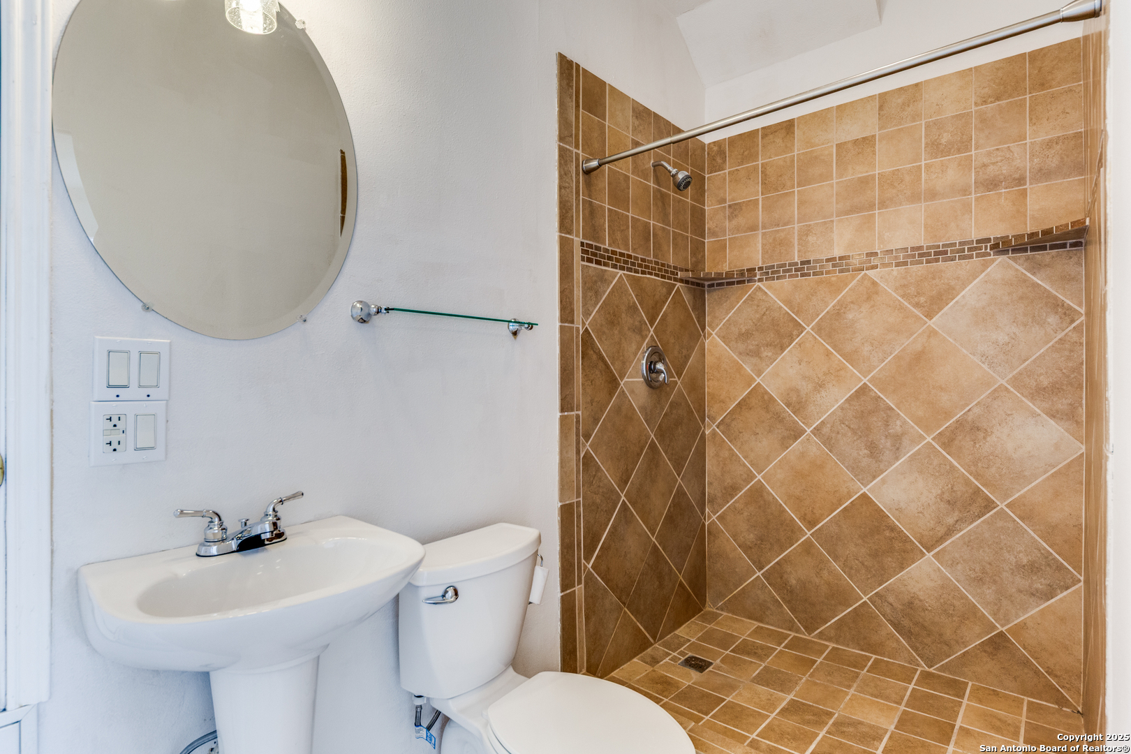 9109 Windwick Boerne, TX 78006 - Photo 29 of 35 a bathroom with a sink toilet and shower