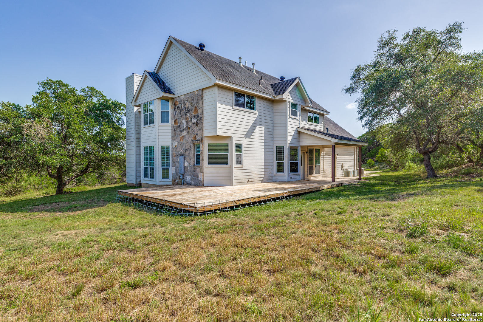 9109 Windwick Boerne, TX 78006 - Photo 30 of 35 a front view of a house with a garden