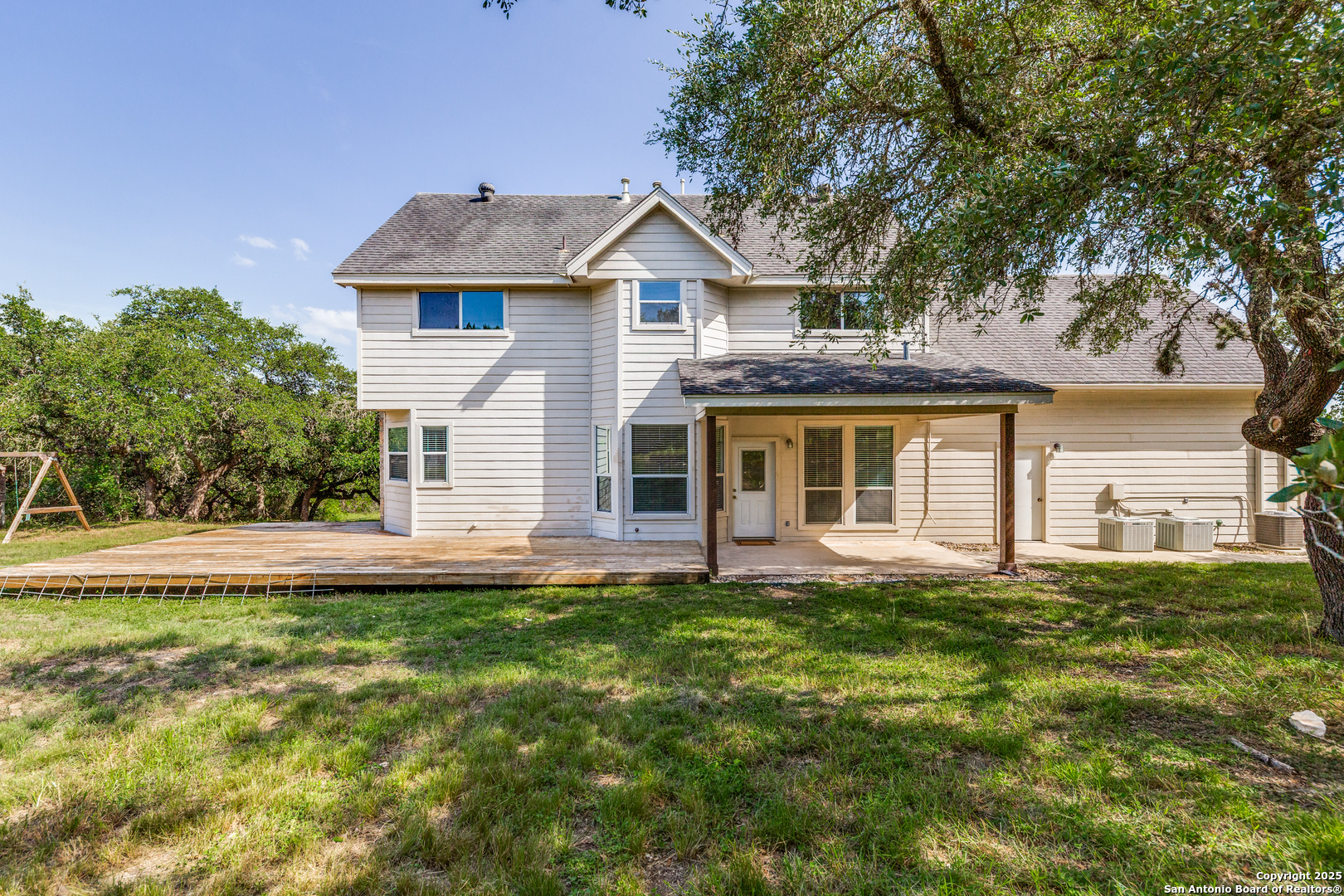 9109 Windwick Boerne, TX 78006 - Photo 31 of 35 a front view of a house with a garden