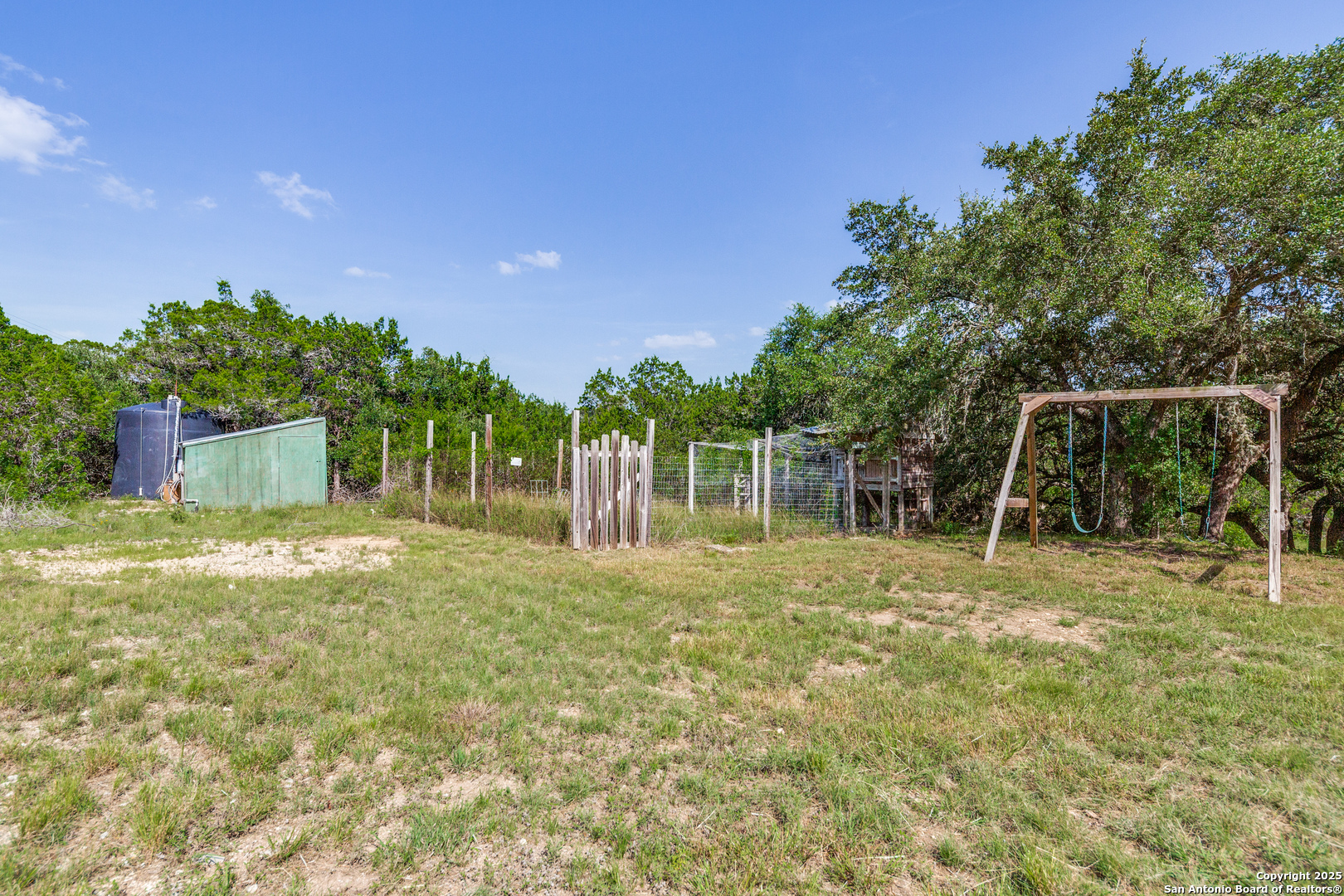 9109 Windwick Boerne, TX 78006 - Photo 35 of 35 a backyard of a house with table and chairs