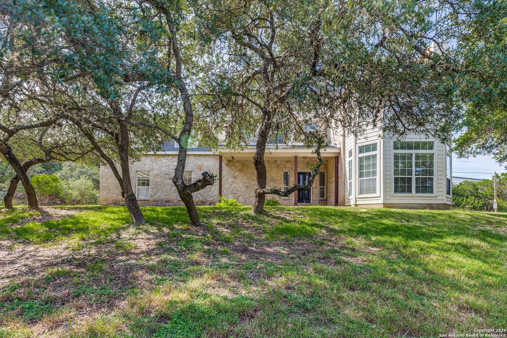 9109 Windwick Boerne, TX 78006 - Photo 4 of 35 a view of a house with backyard and sitting area