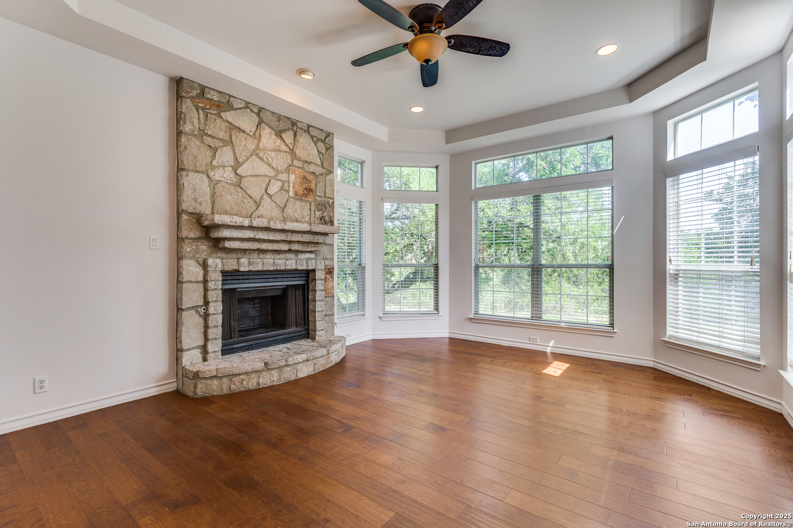 9109 Windwick Boerne, TX 78006 - Photo 8 of 35 a view of a livingroom with a fireplace and wooden floor