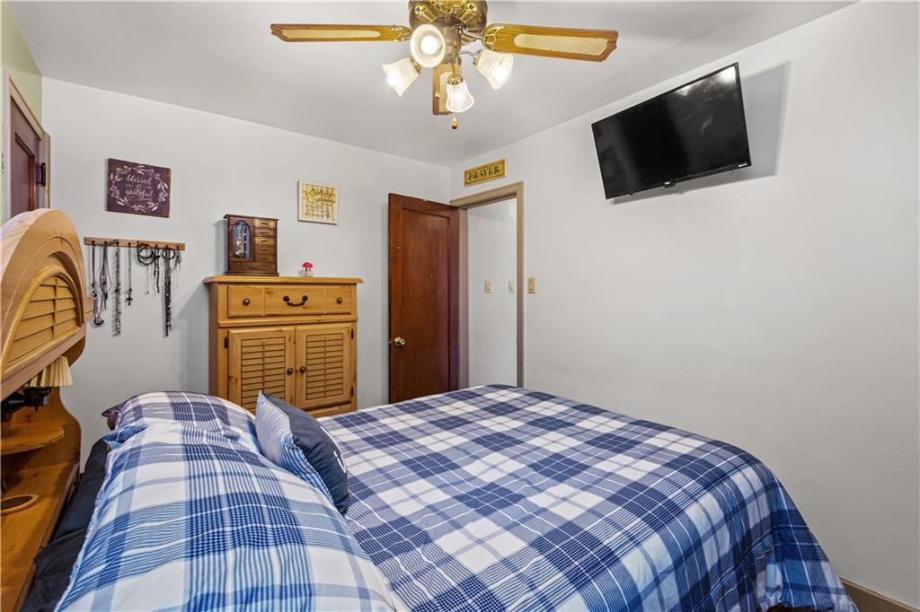 231 Rehoboth Church Road Perryopolis, PA 15473 - Photo 12 of 25 a bedroom with a bed and a flat screen tv
