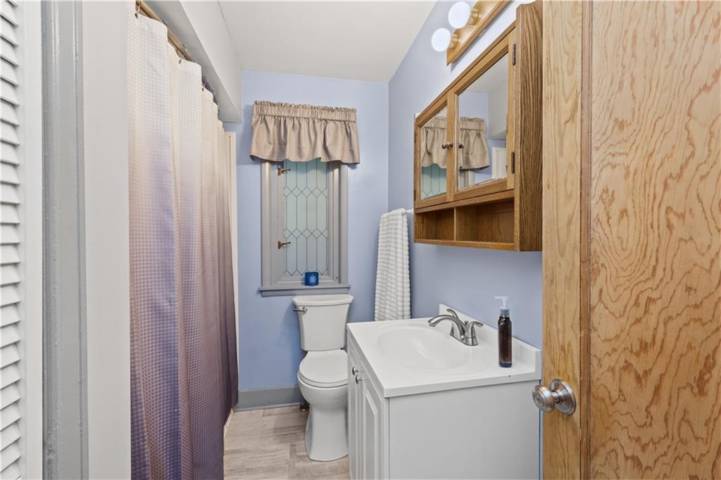 231 Rehoboth Church Road Perryopolis, PA 15473 - Photo 13 of 25 a bathroom with a toilet sink and mirror