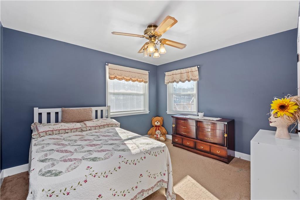 231 Rehoboth Church Road Perryopolis, PA 15473 - Photo 17 of 25 a bedroom with a bed and a chandelier