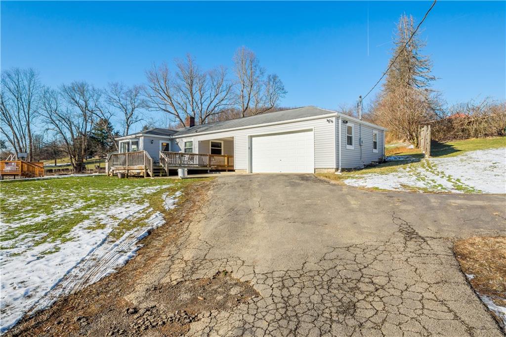 231 Rehoboth Church Road Perryopolis, PA 15473 - Photo 23 of 25 a view of a house with a yard and trees