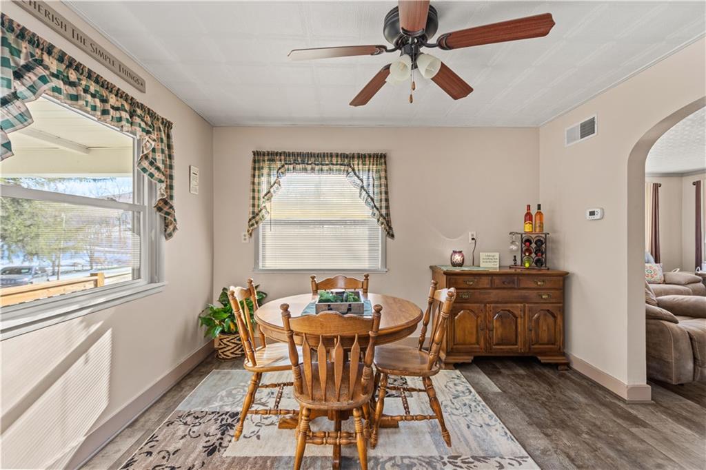 231 Rehoboth Church Road Perryopolis, PA 15473 - Photo 7 of 25 a dining room with furniture a chandelier and wooden floor