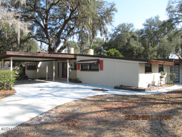 10459 Rutgers Road Jacksonville, FL 32218 - Photo 1 of 28 a house with yard in front of it