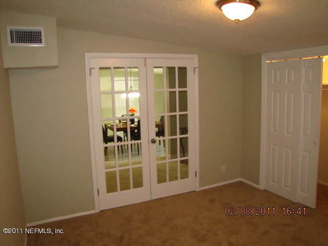 10459 Rutgers Road Jacksonville, FL 32218 - Photo 15 of 28 a view of an empty room with a window