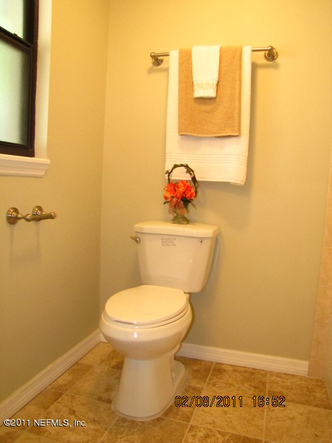 10459 Rutgers Road Jacksonville, FL 32218 - Photo 19 of 28 a bathroom with a toilet and a sink