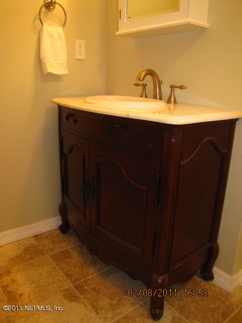 10459 Rutgers Road Jacksonville, FL 32218 - Photo 21 of 28 a sink with a mirror