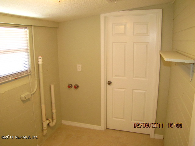 10459 Rutgers Road Jacksonville, FL 32218 - Photo 23 of 28 a view of a bathroom with a shower