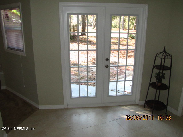 10459 Rutgers Road Jacksonville, FL 32218 - Photo 25 of 28 an empty room with windows