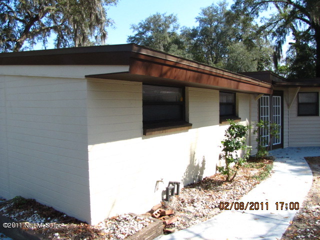 10459 Rutgers Road Jacksonville, FL 32218 - Photo 27 of 28 a view of a house with a tree in the background