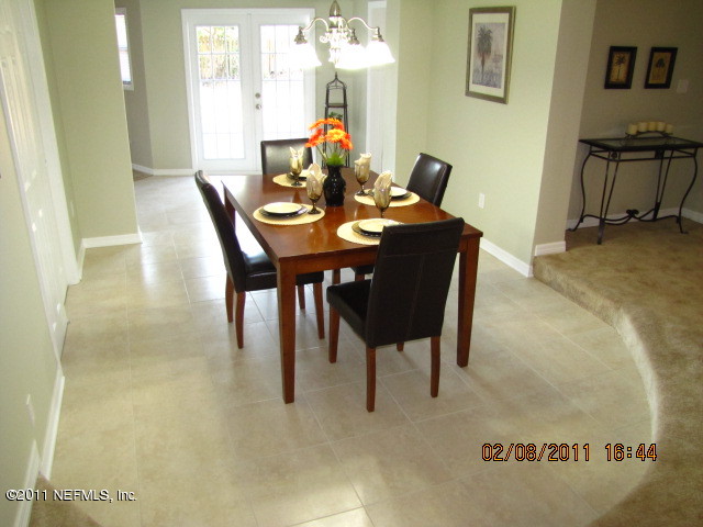 10459 Rutgers Road Jacksonville, FL 32218 - Photo 9 of 28 a dining room with furniture and window