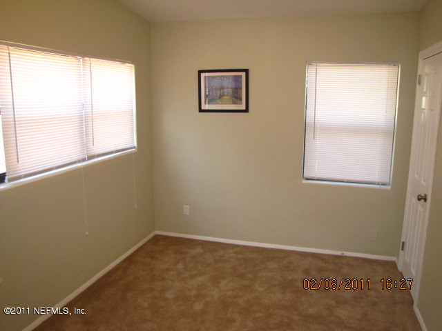 10459 Rutgers Road Jacksonville, FL 32218 - Photo 10 of 28 a view of an empty room with a window