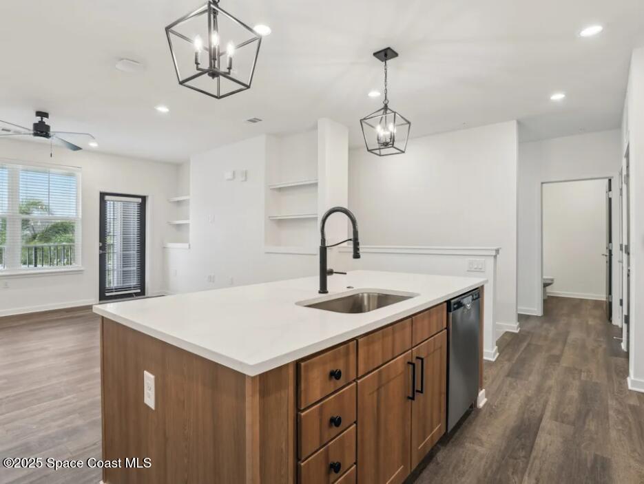 1073 Journey Circle, Unit 107 Rockledge, FL 32955 - Photo 6 of 10 a kitchen with a sink and dishwasher