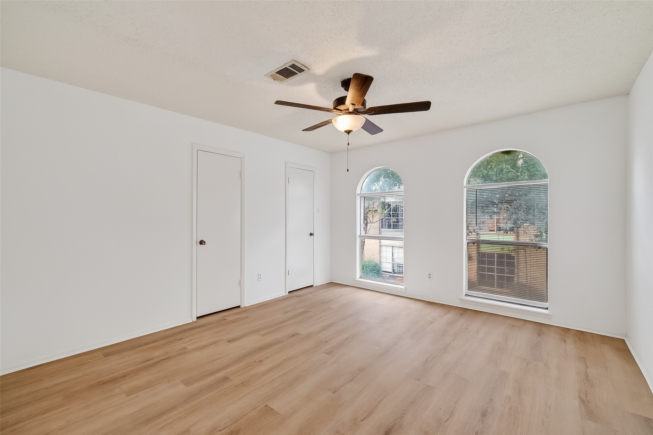 7861 Cook Road Houston, TX 77072 - Photo 12 of 20 a view of an empty room with a window