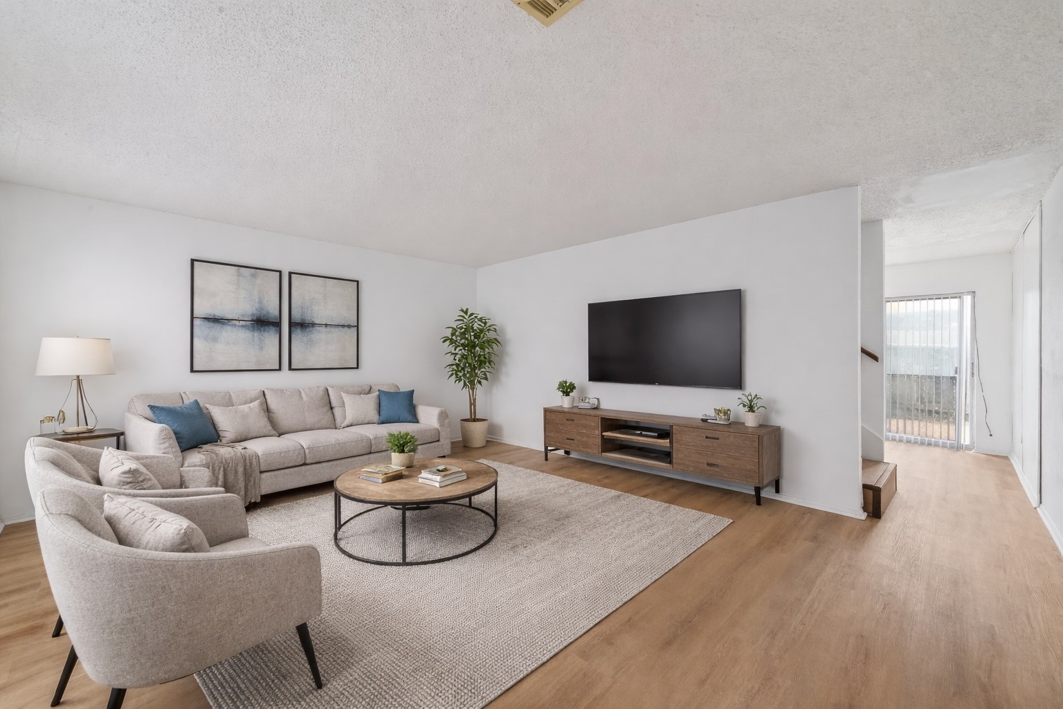 7861 Cook Road Houston, TX 77072 - Photo 3 of 20 a living room with furniture and a flat screen tv