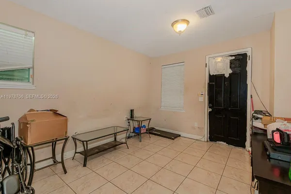 a bedroom with furniture and a window