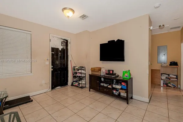 a room with furniture and a flat screen tv