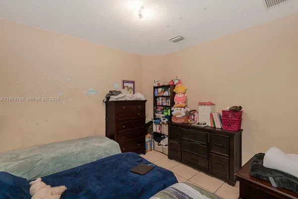 a bedroom with a bed and furniture