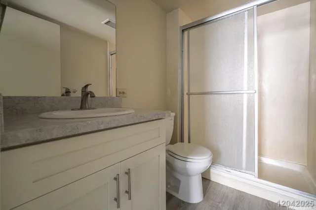 a bathroom with a sink toilet and a mirror