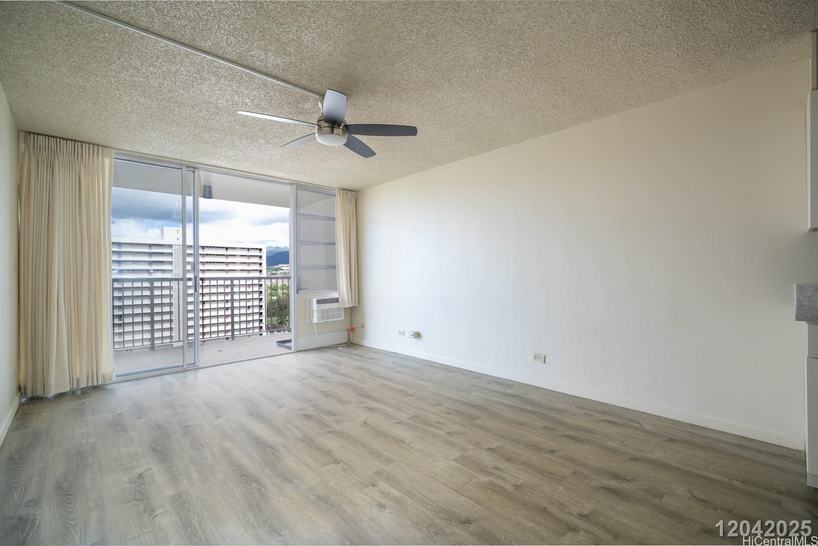 3161 Ala Ilima Street, Unit 1403 Honolulu, HI 96818 - Photo 2 of 24 a view of an empty room with a window