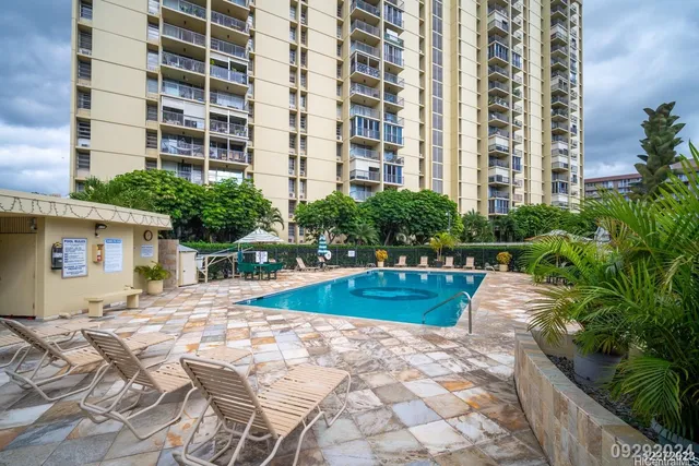 a view of a swimming pool with a patio