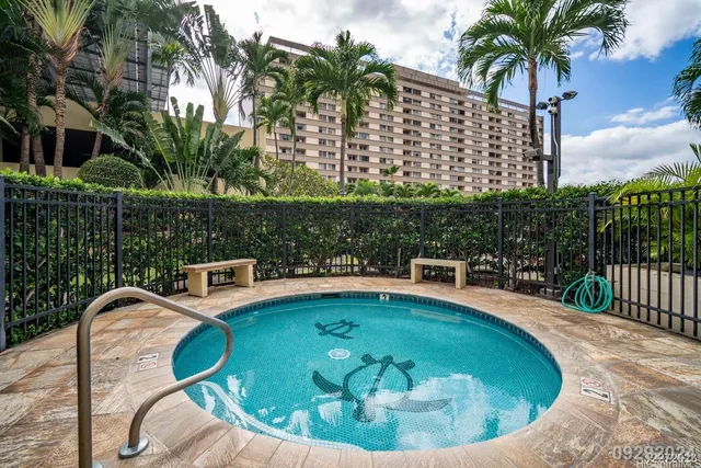 a view of a swimming pool with a patio
