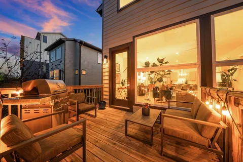 a outdoor space with patio the couches and chairs with wooden floor