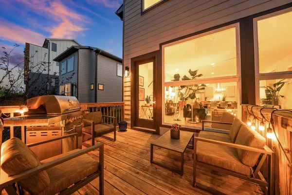 a outdoor space with patio the couches and chairs with wooden floor