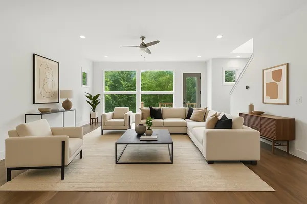 a living room with furniture and a large window