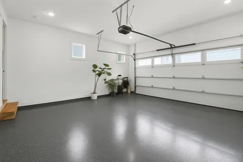 a view of a room with wooden floor and windows